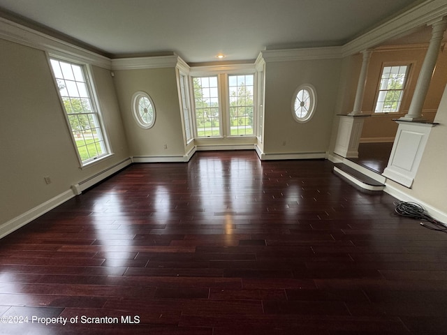 foyer entrance with dark hardwood / wood-style flooring, decorative columns, baseboard heating, and ornamental molding