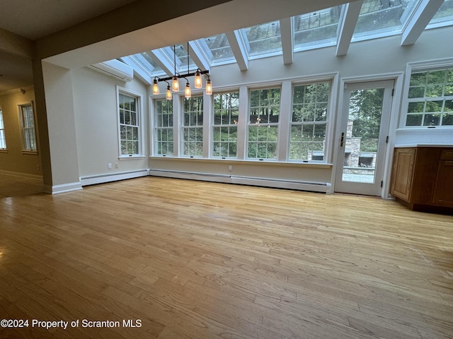 unfurnished sunroom featuring an AC wall unit and a wealth of natural light