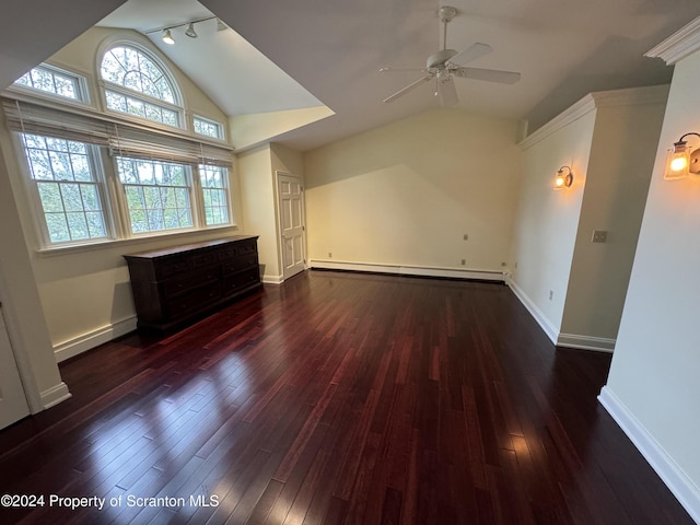 interior space with lofted ceiling, dark wood-type flooring, ceiling fan, and a baseboard heating unit