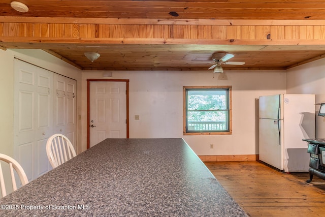 2269 Creek Rd, New Milford, PA 18834 - unfurnished dining area featuring hardwood / wood-style flooring, wood ceiling, baseboards, and ceiling fan