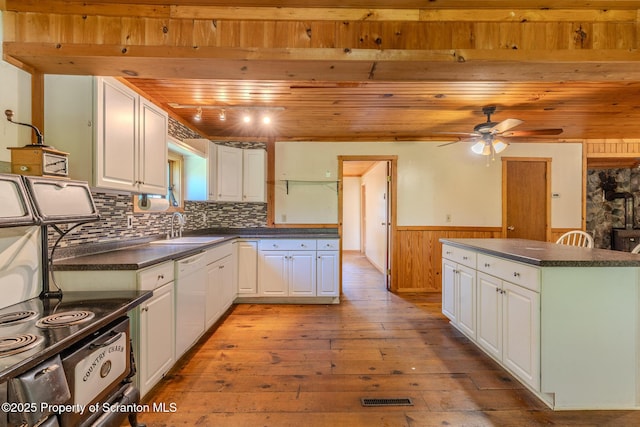 2269 Creek Rd, New Milford, PA 18834 - kitchen featuring wooden ceiling, a sink, dishwasher, dark countertops, and wainscoting