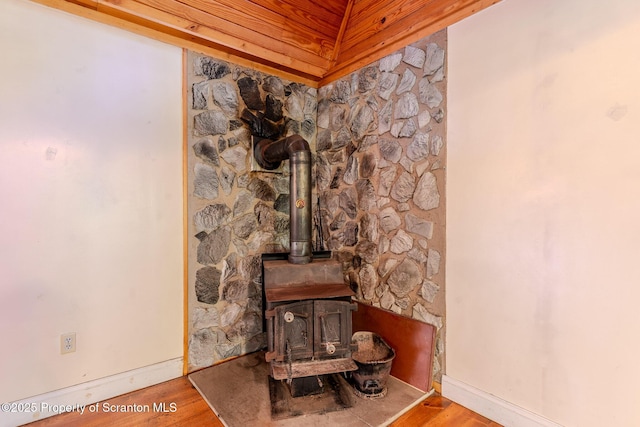 2269 Creek Rd, New Milford, PA 18834 - detailed view of a wood stove, wood finished floors, and baseboards