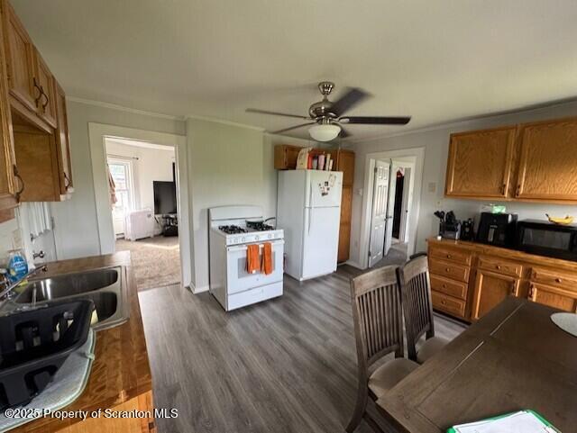 1449 Dickens St, Scranton, PA 18504 - kitchen featuring white appliances, ceiling fan, brown cabinetry, and ornamental molding