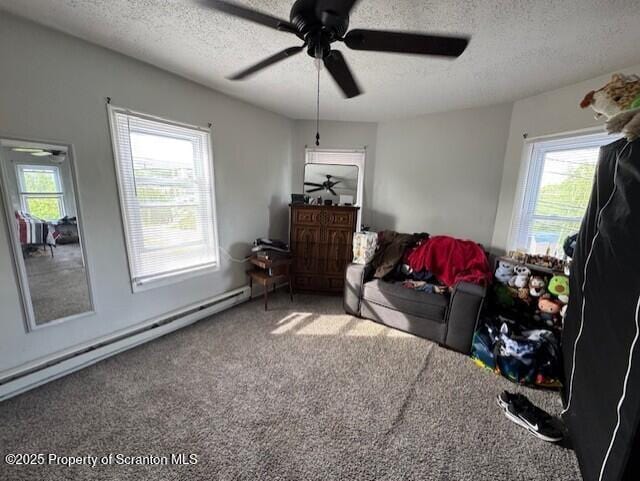 1449 Dickens St, Scranton, PA 18504 - sitting room with a textured ceiling, healthy amount of natural light, ceiling fan, carpet, and baseboard heating
