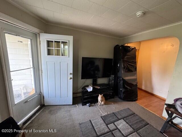 1449 Dickens St, Scranton, PA 18504 - carpeted living area with ornamental molding and plenty of natural light