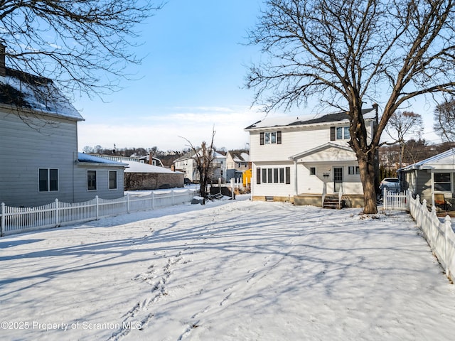 view of snow covered house