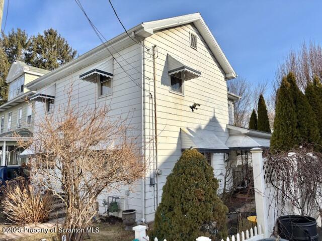 view of side of property with fence