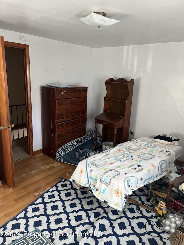 bedroom featuring wood-type flooring