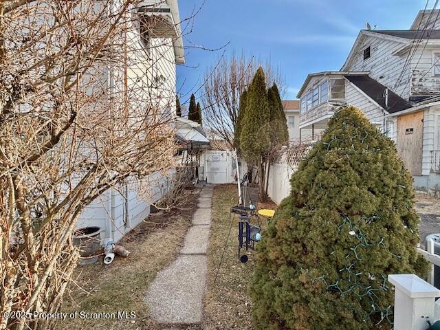 view of side of property with fence