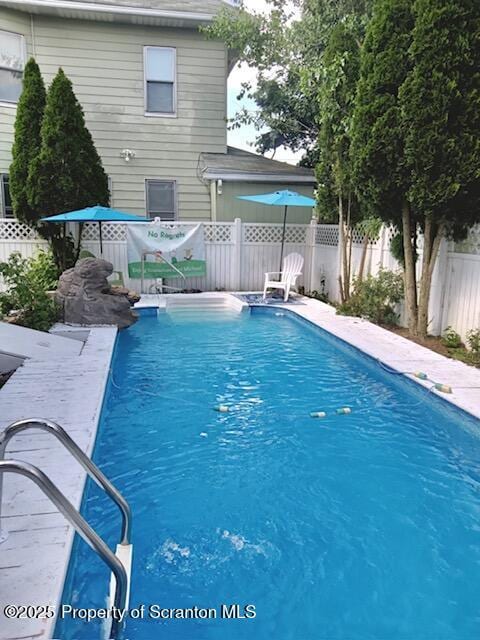 view of pool featuring a fenced backyard and a fenced in pool