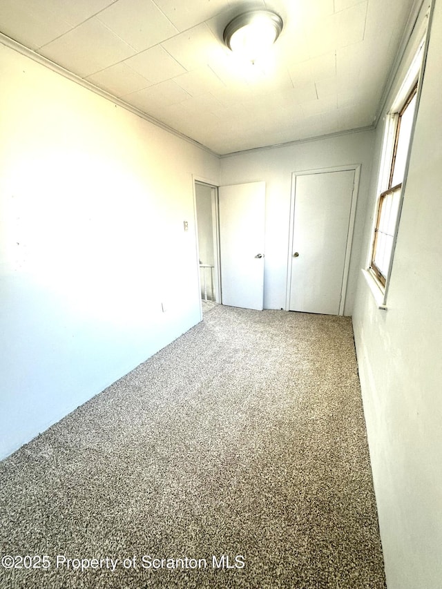 unfurnished bedroom featuring carpet flooring