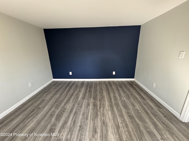 empty room featuring dark hardwood / wood-style floors