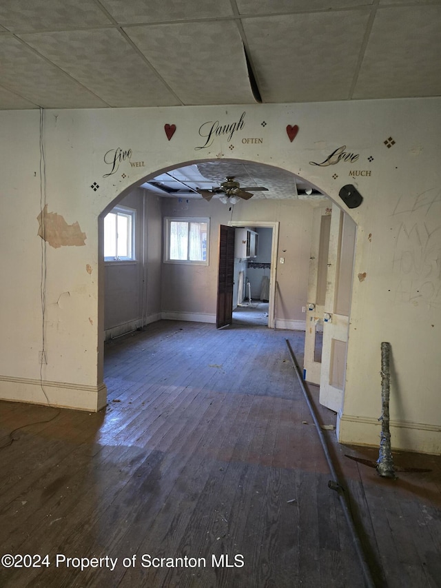 unfurnished room with ceiling fan and hardwood / wood-style floors