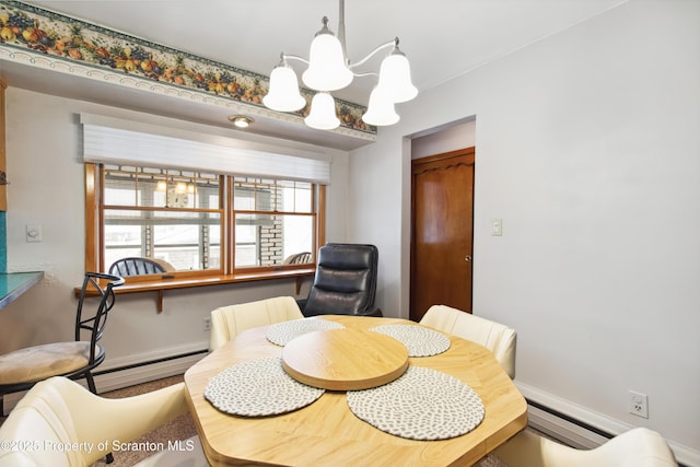 dining space featuring a notable chandelier and baseboard heating