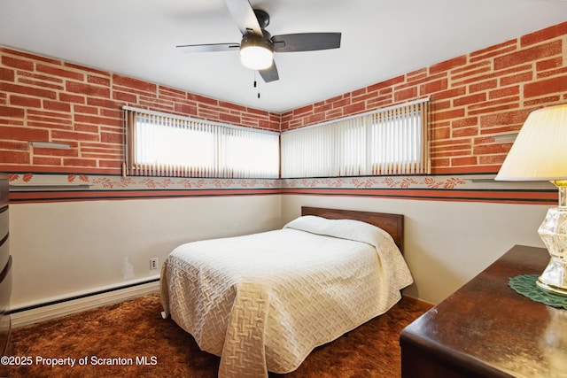 carpeted bedroom with ceiling fan and a baseboard radiator