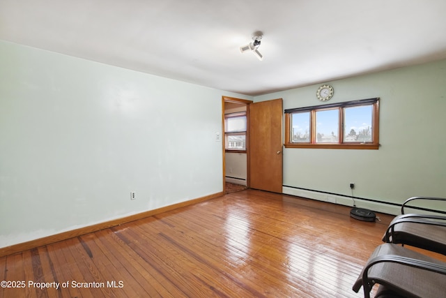 interior space featuring light wood-type flooring and a baseboard radiator