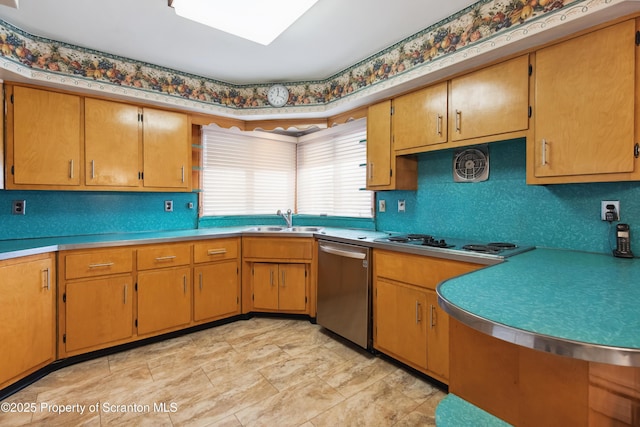 kitchen featuring sink, dishwasher, and stovetop