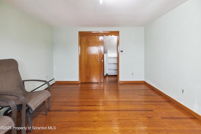 living area with hardwood / wood-style floors