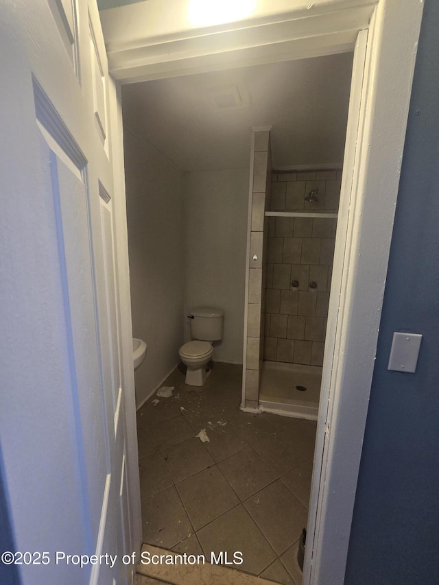 bathroom with tile patterned floors and toilet