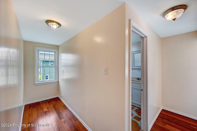 hall with dark wood-type flooring