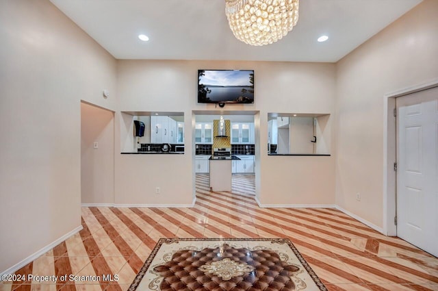 entrance foyer featuring an inviting chandelier