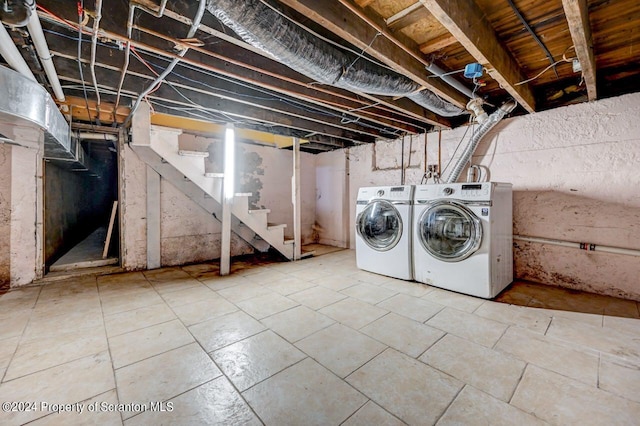 basement with washing machine and clothes dryer