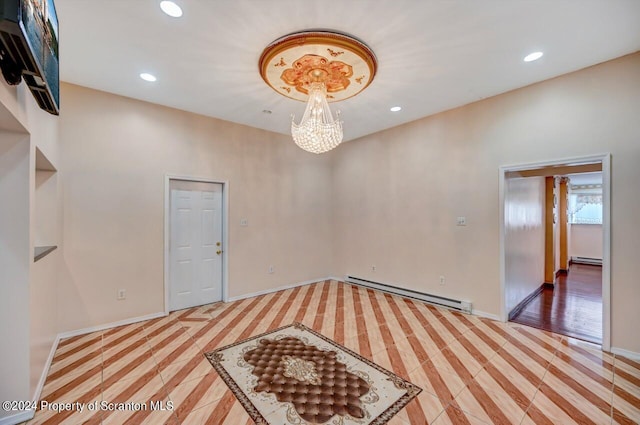 936 Main St, Peckville, PA 18452 - empty room with a notable chandelier and baseboard heating