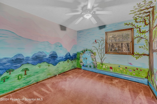 interior space featuring a baseboard heating unit, carpet, a textured ceiling, and a ceiling fan