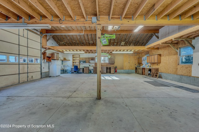 garage with freestanding refrigerator