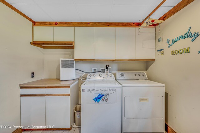 laundry area with cabinet space and washing machine and dryer