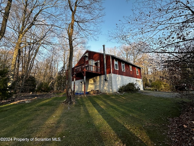 view of property exterior with a yard