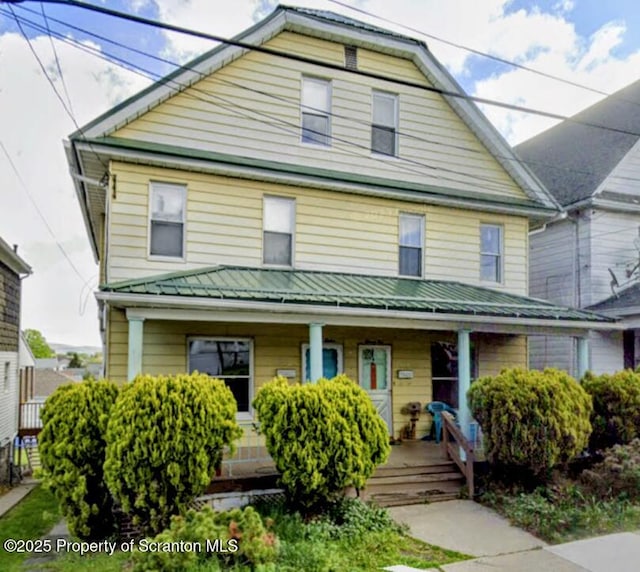 1110-1112 W Elm St, Scranton, PA 18504 - view of front of home with a porch, metal roof, and a standing seam roof