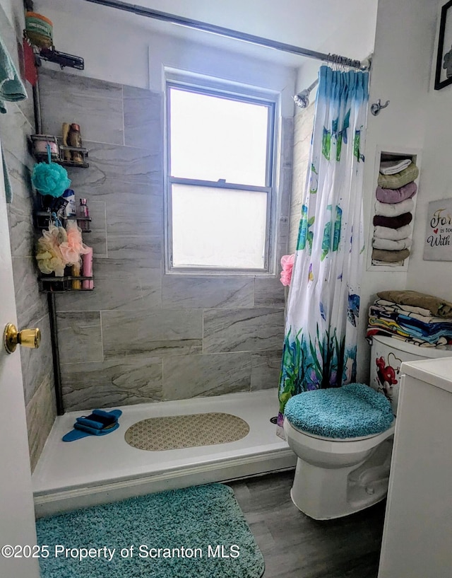 1110-1112 W Elm St, Scranton, PA 18504 - bathroom with toilet, a shower stall, and wood finished floors