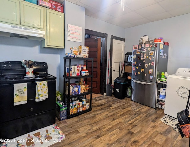 1110-1112 W Elm St, Scranton, PA 18504 - kitchen featuring black electric range, washer / clothes dryer, under cabinet range hood, freestanding refrigerator, and green cabinets