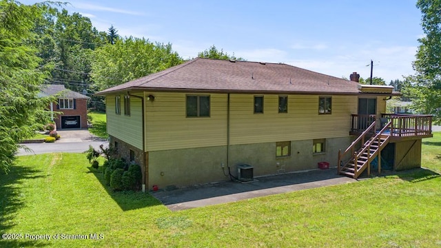 1103 Quarry Rd, Old Forge, PA 18518 - back of house with stairway, a lawn, a deck, and a chimney