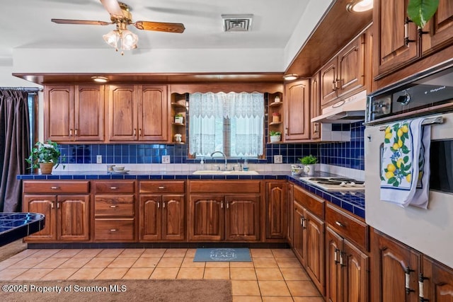 1103 Quarry Rd, Old Forge, PA 18518 - kitchen with tile countertops, open shelves, and under cabinet range hood