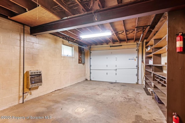1103 Quarry Rd, Old Forge, PA 18518 - garage featuring heating unit, concrete block wall, and electric panel