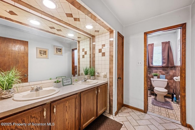 1103 Quarry Rd, Old Forge, PA 18518 - bathroom with double vanity and tile walls