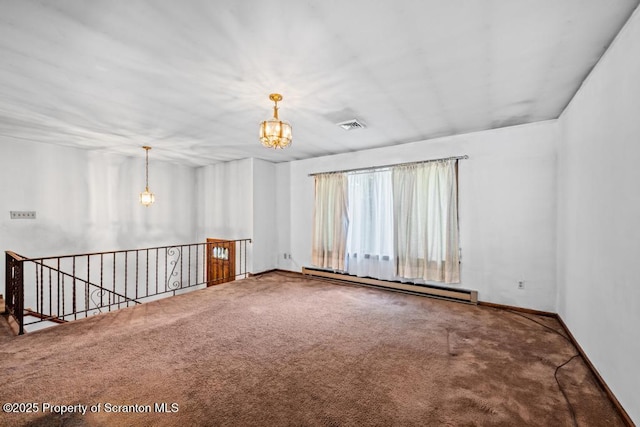 1103 Quarry Rd, Old Forge, PA 18518 - carpeted spare room with a baseboard heating unit and a chandelier