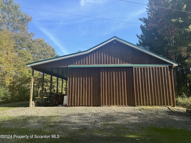 3365 Lake Of Meadows Rd, Little Meadows, PA 18830 - view of side of property featuring a detached garage, an outbuilding, and an outdoor structure