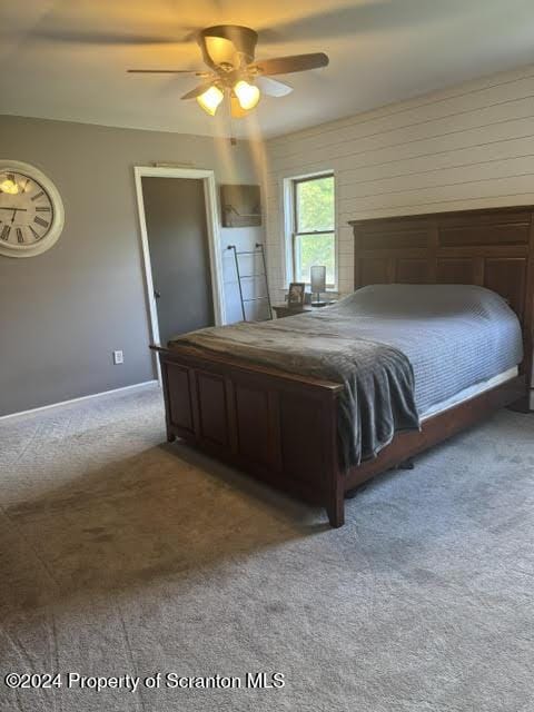 unfurnished bedroom with carpet flooring and ceiling fan