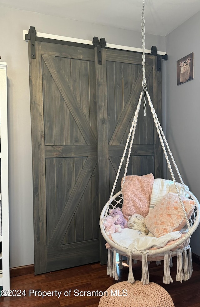 3365 Lake Of Meadows Rd, Little Meadows, PA 18830 - sitting room featuring a barn door and wood finished floors