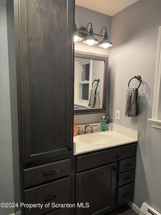 3365 Lake Of Meadows Rd, Little Meadows, PA 18830 - bathroom featuring a baseboard radiator and vanity