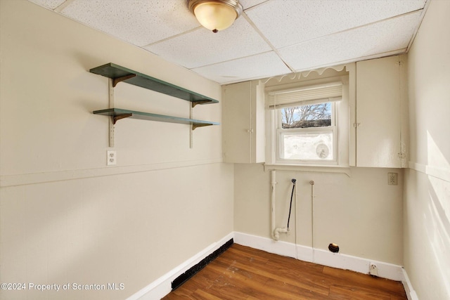 laundry room featuring hookup for a washing machine and dark wood-type flooring