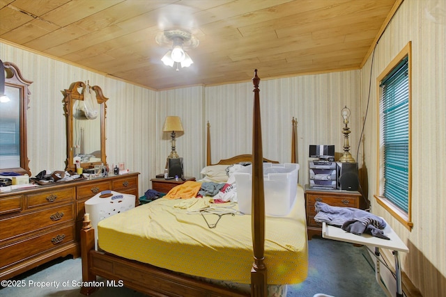 bedroom featuring ceiling fan, carpet, and wooden ceiling