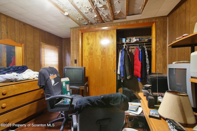 office area featuring wooden walls