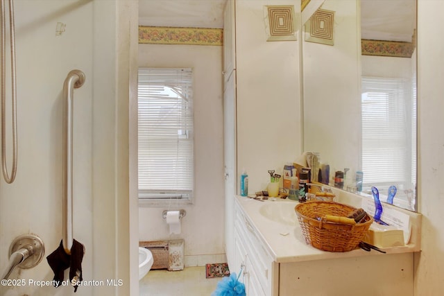 bathroom with vanity, tile patterned flooring, and toilet