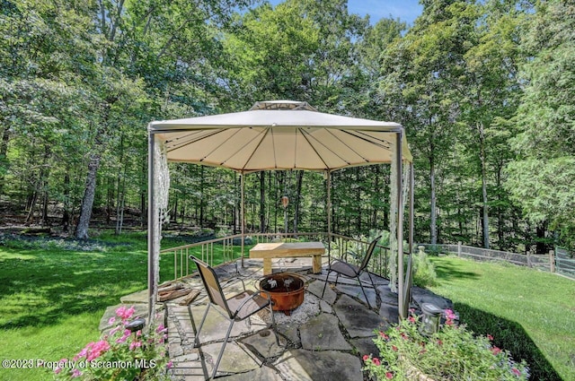 view of patio / terrace with a gazebo and a fire pit