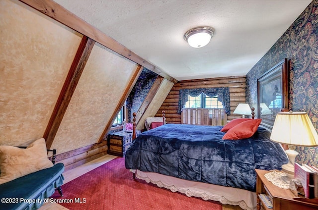 bedroom featuring a textured ceiling and log walls