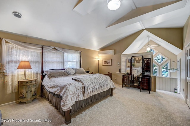 bedroom with carpet, vaulted ceiling, and an AC wall unit